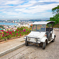 Buy canvas prints of Pulmonia taxi with panoramic view of the Mazatlan Old City by Elijah Lovkoff