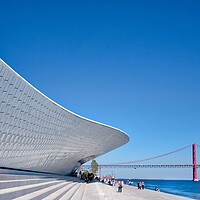 Buy canvas prints of Famous MAAT Museum in Lisbon near river Tagus and Landmark 25 of April bridge by Elijah Lovkoff