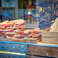 Buy canvas prints of Famous Spanish jamon sandwich sold at the streets of Granada historic city center by Elijah Lovkoff