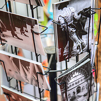 Buy canvas prints of Souvenirs and postcards on display near Plaza De Espana in Sevilla by Elijah Lovkoff