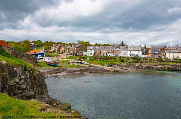 Storm Clouds over Craster Village Picture Board by Michael Birch