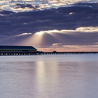 Buy canvas prints of Rays over the pier by Geoff Taylor