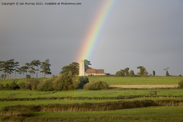 Rainbow shining on Ramsholt church Picture Board by Ian Murray