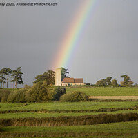 Buy canvas prints of Rainbow shining on Ramsholt church by Ian Murray