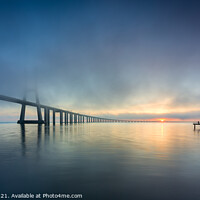 Buy canvas prints of Long bridge over tagus river in Lisbon at sunrise with fog by Paulo Rocha