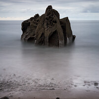 Buy canvas prints of Long exposure seascape with a rock formation on the beach  by Paulo Rocha