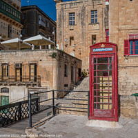 Buy canvas prints of Red telephone booth in Valletta Malta.  by Maria Vonotna