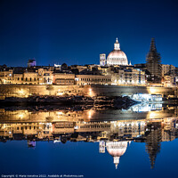 Buy canvas prints of Illuminated at night harbor of Valletta old town with reflection by Maria Vonotna