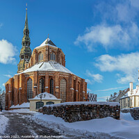 Buy canvas prints of Saint Peter's church against blue sky in winter in Riga, Latvia. by Maria Vonotna
