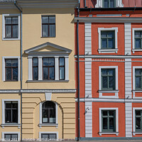 Buy canvas prints of Colorful facade with yellow and red of historic buildings by Maria Vonotna