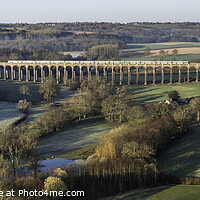 Buy canvas prints of Viaduct with green train by Paul Hutchings