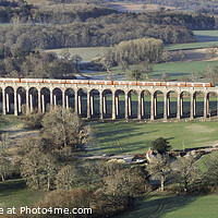 Buy canvas prints of Red train 2 at Ouse valley Viaduct by Paul Hutchings