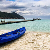 Buy canvas prints of Redang Island, Malaysia Colourful blue kayak boat on the beach r by johnseanphotography 