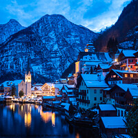 Buy canvas prints of Hallstatt Cityscape on a Winter Evening Covered with Snow by Dietmar Rauscher