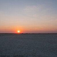 Buy canvas prints of Sun Setting in Makgadikgadi Salt Pan - Empty Flat Plain and Hori by Dietmar Rauscher