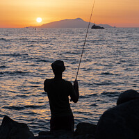 Buy canvas prints of Fisherman on the Sorrentine Coast in the Sunset across Ischia by Dietmar Rauscher