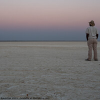 Buy canvas prints of Dusk in Makgadikgadi Salt Pan - Black Man Gazing at Horizon by Dietmar Rauscher