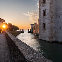 Buy canvas prints of Scaligero Castle in Sirmione on Lake Garda, Italy at Sunrise by Dietmar Rauscher