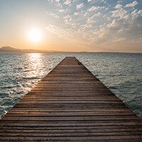 Buy canvas prints of Lake Garda Jetty at Sunrise at Sirmione by Dietmar Rauscher