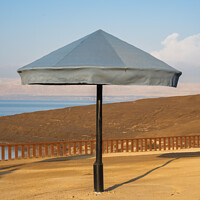 Buy canvas prints of Beach Umbrella at the Dead Sea, Jordan by Dietmar Rauscher