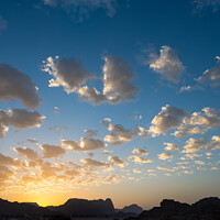 Buy canvas prints of Blue and Yellow Evening Sky in Wadi Rum, Jordan by Dietmar Rauscher