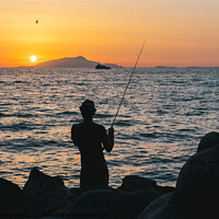 Buy canvas prints of Fisherman on the Sorrentine Coast in the Sunset across Ischia by Dietmar Rauscher