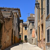 Buy canvas prints of Alcudia Old Town medieval street. Majorca by Paulina Sator