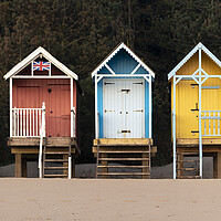 Buy canvas prints of Colourful English Beach huts by Sonny Ryse