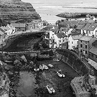 Buy canvas prints of Staithes Coastal town england black and white by Sonny Ryse