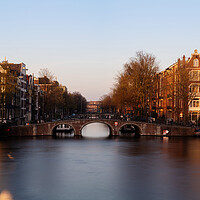 Buy canvas prints of Amstel River and Architecture Amsterdam Netherlands Sunset by Sonny Ryse
