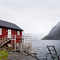 Buy canvas prints of Red Rorbu Rorbuer Fishing cabin hut Reinefjorden Lofoten Islands by Sonny Ryse