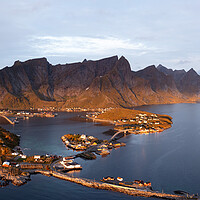 Buy canvas prints of Reinefjorden Sakrisoy and Reine Fishing villages Aerial Lofoten Islands by Sonny Ryse