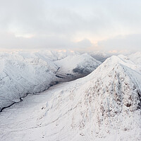 Buy canvas prints of Buachaille Etive Mòr Stob Dearg mountain covered in snow aerial Glencoe Scotland by Sonny Ryse