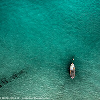 Buy canvas prints of A lonely boat by Fanis Zerzelides