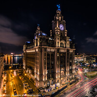 Buy canvas prints of Dramatic shot of the Royal Liver Building and the Liverpool skyl by Paul Hanley