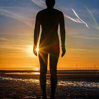 Buy canvas prints of A lonely figure stands silent on Crosby beach by Paul Hanley