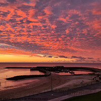 Buy canvas prints of Spectacular sunrise sky over the Cobb Lyme Regis by Love Lyme Regis