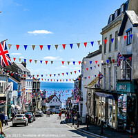 Buy canvas prints of Broad Street Lyme Regis with bunting and union jack flags by Love Lyme Regis