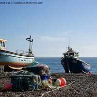Buy canvas prints of Waiting for the Tide A Serene Fishing Scene in Dev by Les Schofield