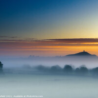 Buy canvas prints of Majestic Sunrise Over Glastonbury Tor by Les Schofield
