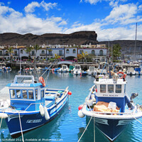Buy canvas prints of Fishing Boats in Mogan Gran Canaria by Les Schofield