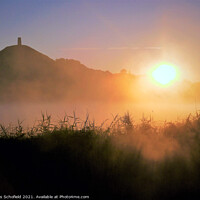 Buy canvas prints of A Mystical Sunrise at Glastonbury Tor by Les Schofield