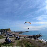 Buy canvas prints of Paragliding over  west Bay Jurassic coast by Les Schofield