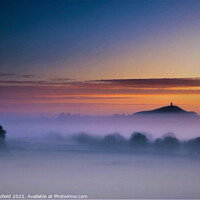Buy canvas prints of Majestic Sunrise Over Glastonbury Tor by Les Schofield