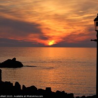 Buy canvas prints of Breathtaking Sunset over Ilfracombe by Les Schofield