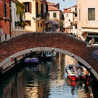 Buy canvas prints of Bridge over canal Venice  by Les Schofield