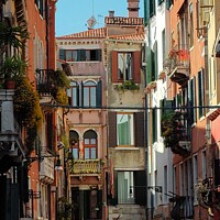 Buy canvas prints of Charming Venice Alleyway by Les Schofield