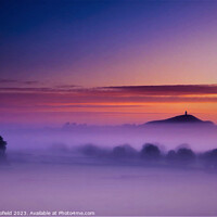 Buy canvas prints of Glastonbury Tor in morning mist by Les Schofield