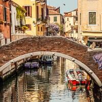 Buy canvas prints of The back canals of Venice  by Les Schofield
