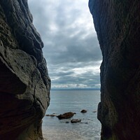 Buy canvas prints of View through the rocks. by Rachel Goodfellow
